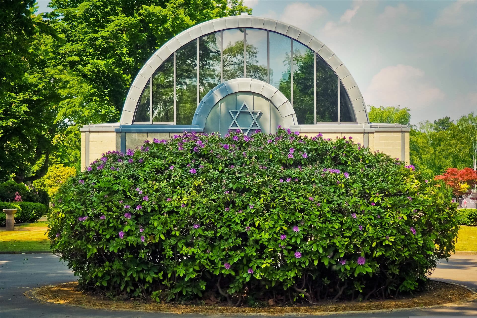 Jewish cemetery chapel with a Star of David surrounded by flowering greenery for NFTY (North American Federation of Temple Youth)