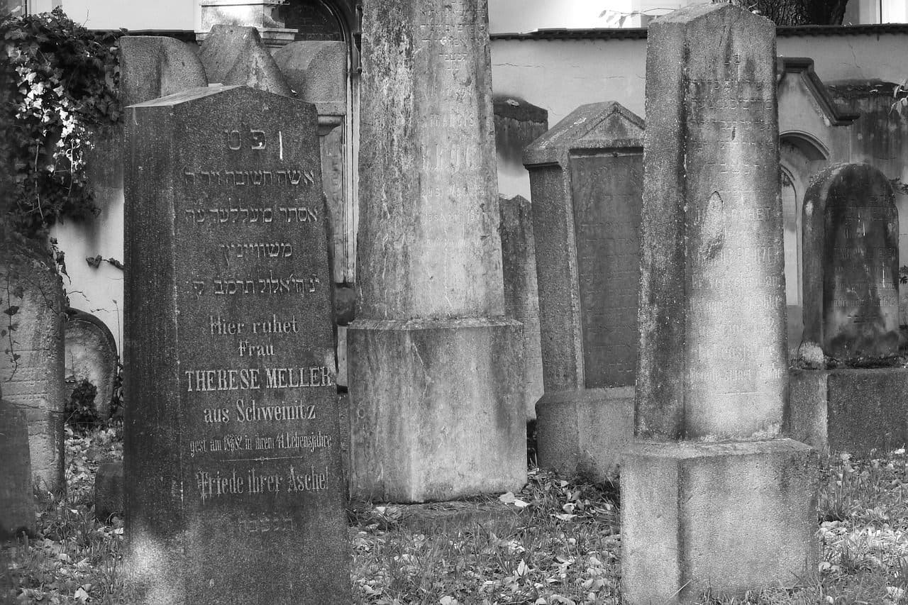 Historic Jewish cemetery headstones with Hebrew inscriptions